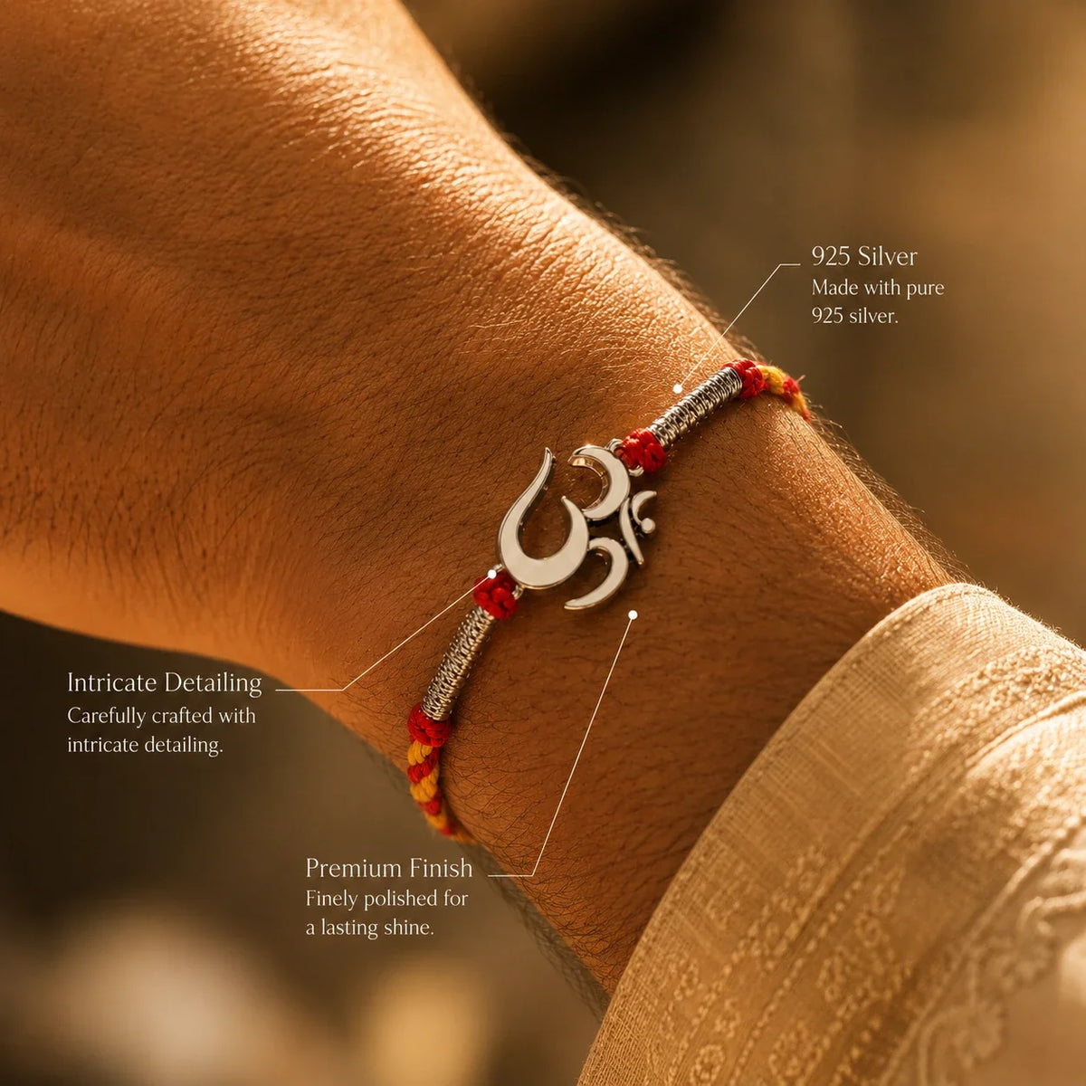 925 silver Big Om rakhi with an Om motif on a red and gold braided thread