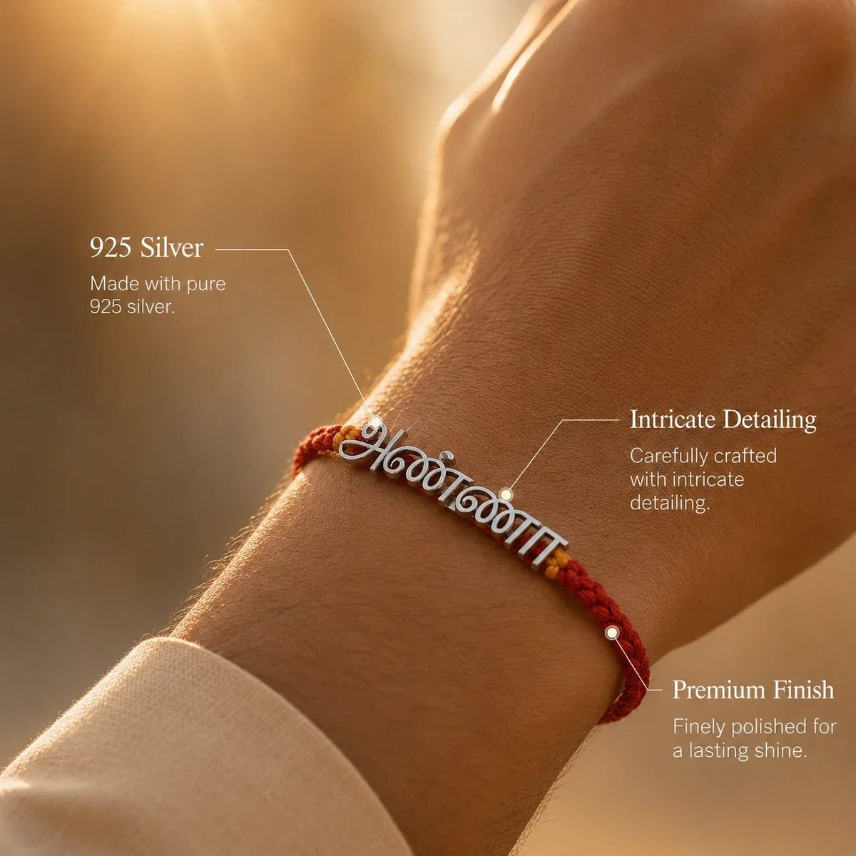 925 silver Tamil Anna rakhi with அண்ணா engraved in Tamil script on a red braided thread