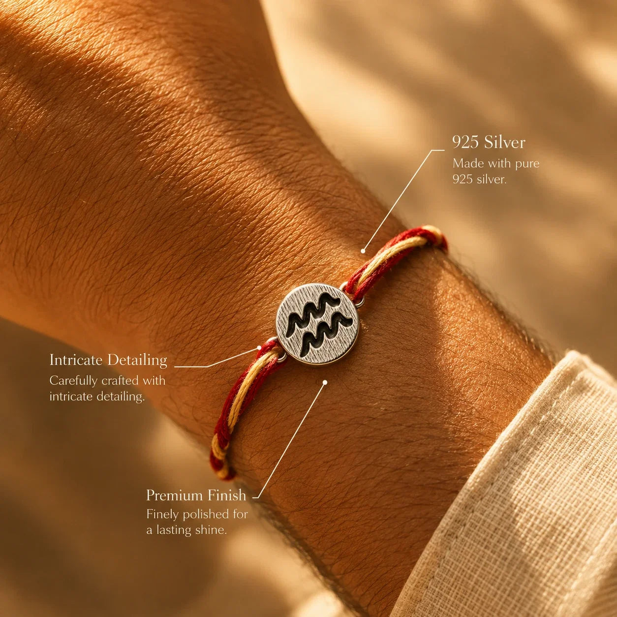 925 silver Aquarius zodiac rakhi on a red and gold braided thread