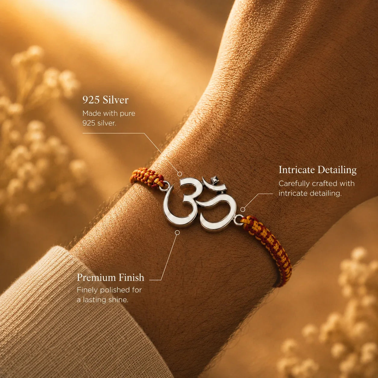 925 silver Big Om rakhi with an Om motif on a red and gold braided thread