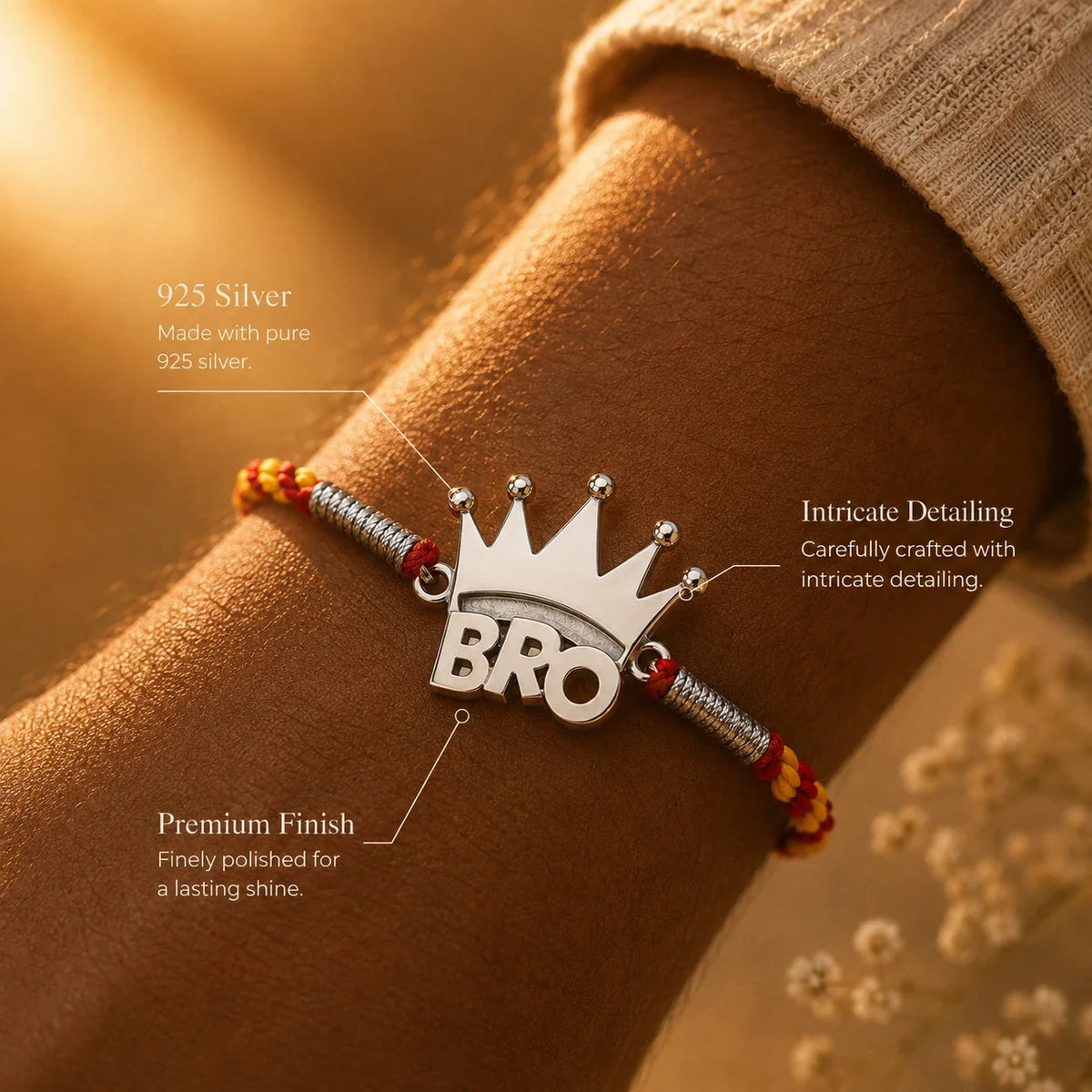 925 silver Crown Bro rakhi with a crowned BRO charm on a red and gold braided thread