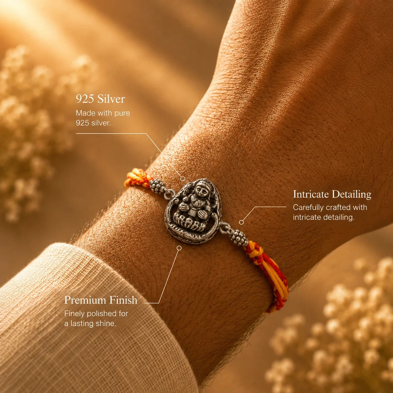 925 silver Lakshmi rakhi with a Goddess Lakshmi motif on a red and gold braided thread