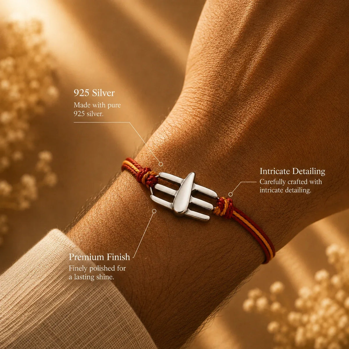 925 silver Namam rakhi with a three-bar Namam motif on a red and gold braided thread